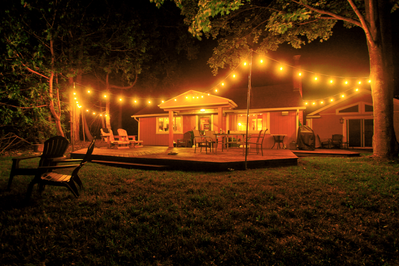 vacation rental patio with seating and string lights