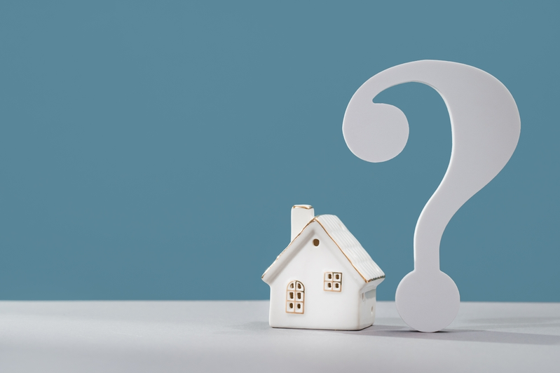 model of house next to question mark