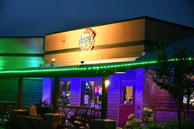 Three Jimmy's at night