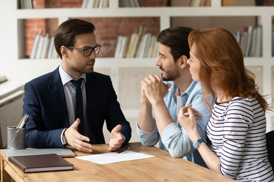 couple meeting with mortgage loan officer
