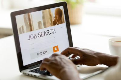 searching job openings on laptop