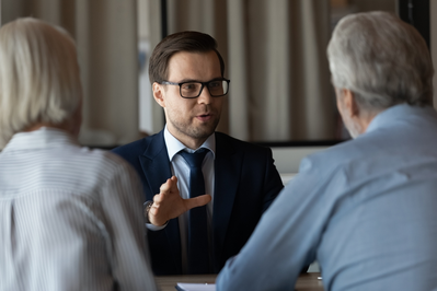 real estate agent talking to prospective buyers
