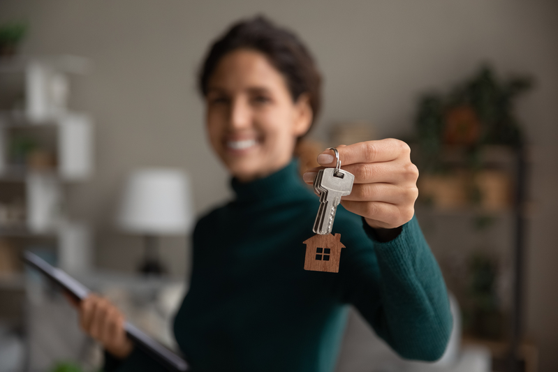 real estate agent holding up house keys