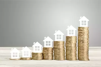 house on increasing stacks of coins to show appreciation