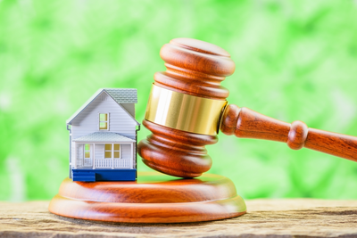 model of house and judge's gavel