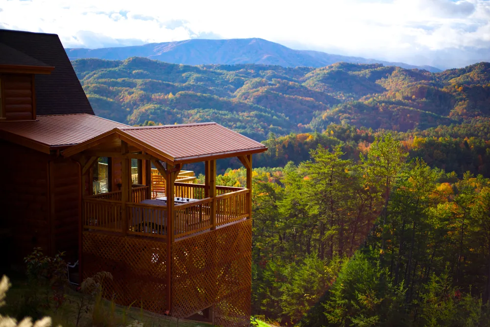 cabin with view of Smoky Mountains covered in fall foliage