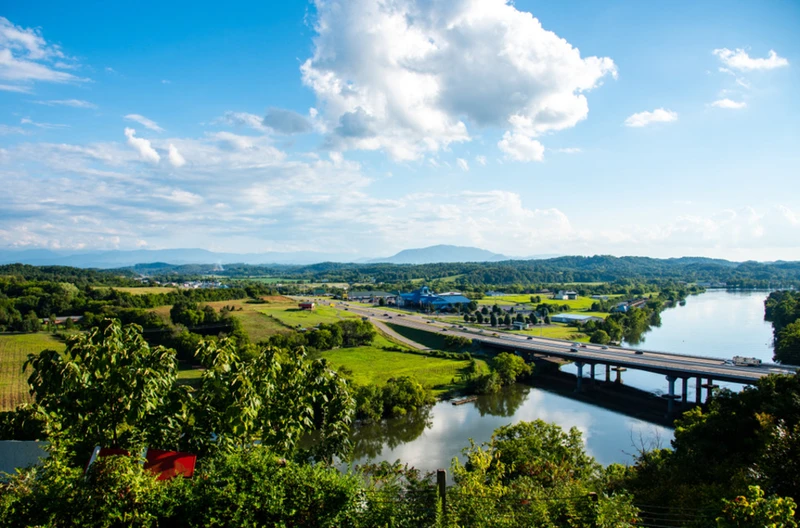 view of Sevierville TN and Smoky Mountains from French Broad River
